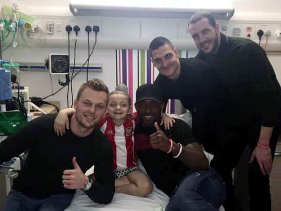 Bradley Lowery being visited in hospital by Sunderland football players (left to right) Seb Larsson, Jermain Defoe, Vito Mannone and John O'Shea.