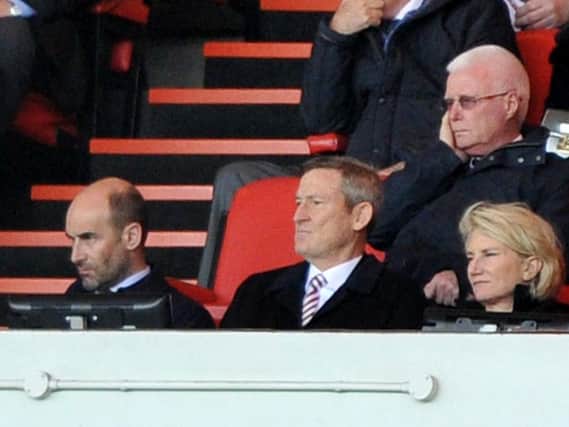 Owner Ellis Short watches the action
