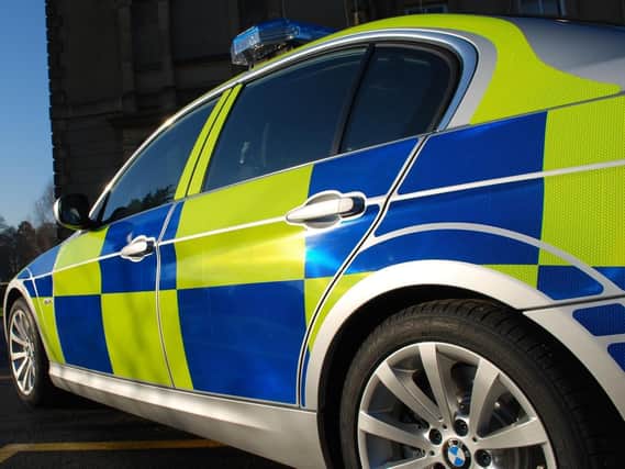 Police are appealing for information after a brick was thrown at a car in Washington