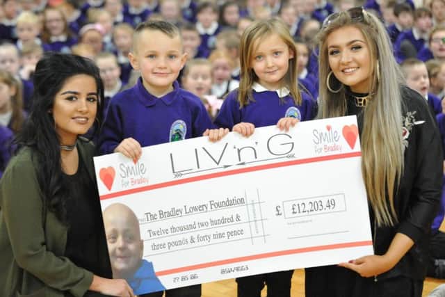 Blackhall Primary School pupils Harley-Jay and Lasey with Olivia Crawford and Georgia Fletcher from LIV'n'G, who have raised 12,203 for the Bradley Lowery Foundation.