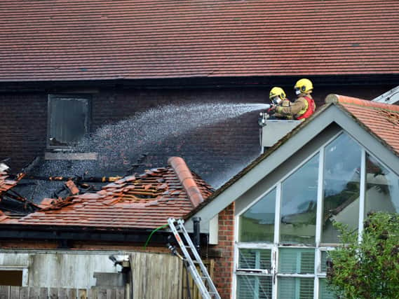 Firefighters working at the scene yesterday.