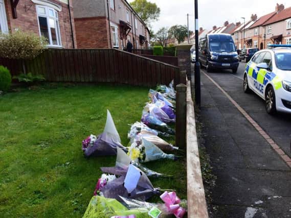 Floral tributes left outside the house in Shrewsbury Crescent in which the bodies of Alan Martin and Kay Martin were found.