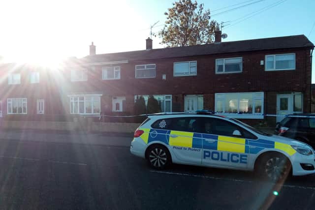 Police outside the damaged house in Fordfield Road yesterday morning.