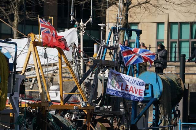 Fishing vessels display a pro-Brexit flags during a protest at Newcastle Quayside. Owen Humphreys/PA Wire