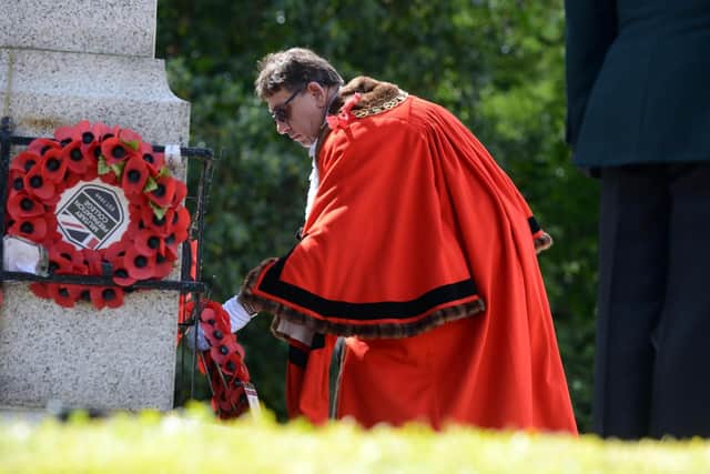 Mayor of Sunderland, Councillor David Snowdon, lays a wreath during the commemoration event.