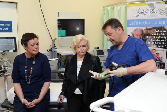 Bowel cancer patient Paula Fowler,  Lady Elsie Robson and Professor Colin Rees are shown the equipment used in endoscopy units.