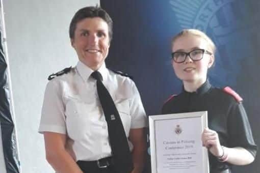 Emma Bell is presented her accolade by Chief Superintendent Sarah Pitt.