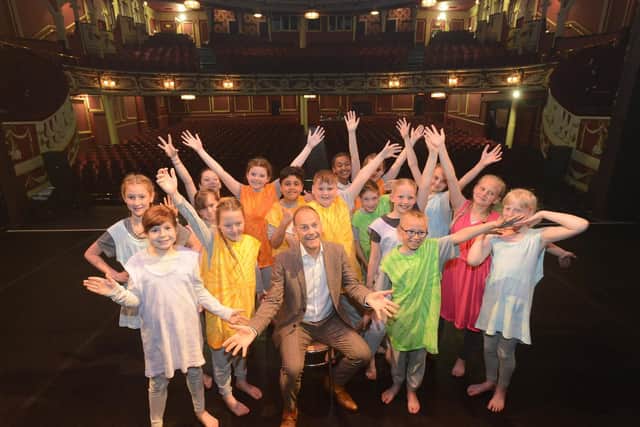 Pupils from Grangetown Primary School pupil with compere Jeff Brown at the Sunderland Schools Dance Festival.