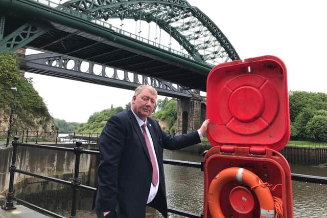 Councillor John Kelly with some of the public rescue equipment near Wearmouth Bridge