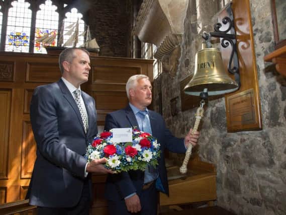 Sailors Society Trustee Jon Holloway and the charitys CEO Stuart Rivers lay a wreath in the Mariners Chapel at All Hallows by the Tower in London to commemorate the 25th anniversary of the British Trent tragedy.