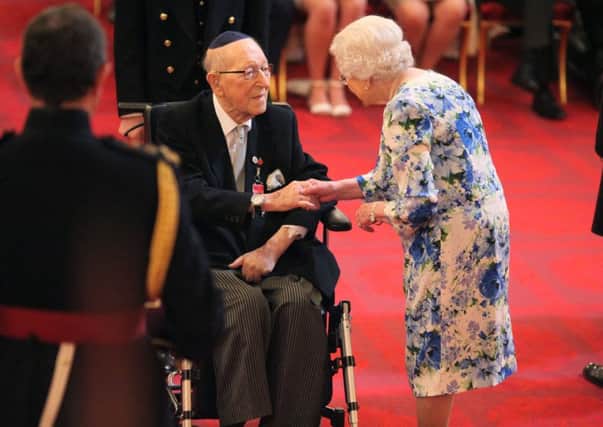 Lieutenant Colonel Mordaunt Cohen, 101, is made an MBE (Member of the Order of the British Empire) by Queen Elizabeth II for services to Second World War education during an Investiture ceremony at Buckingham Palace in central London. Pic by PA.