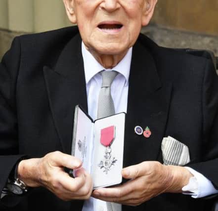 Lieutenant Colonel Mordaunt Cohen, 101, holds his MBE (Member of the Order of the British Empire) after it was awarded to him by Queen Elizabeth II for services to Second World War education during an Investiture ceremony at Buckingham Palace in central London. Pic by PA.