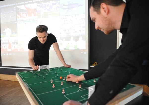 Taking on the challenge Adam Cassell and Ryan Young at The Peacock's Subbuteo World Cup.