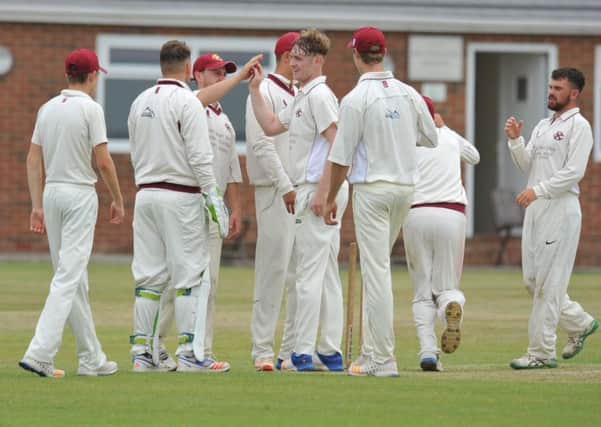 Eppleton bowler Jack McBeth, centre, gets congratulated after a wicket against Newcastle on Saturday. Picture by Tim Richardson