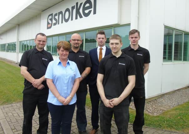 Tanya English from Gem Training with new Snorkel employees Paul Reveley and Andrew Lowery, left, and Luke MacDonld and Dean Wilkinson, right, with a management representative from the company.