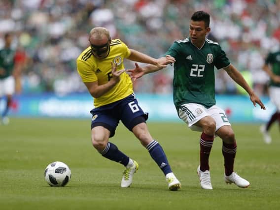 Dylan McGeouch, left, in action for Scotland against Mexico.