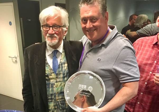 Clive Dunning, right, with his Brain of Britain trophy and show host Russell Davies.