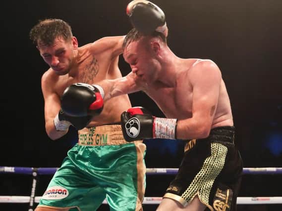 Glenn Foot clashes with Sam Omidi in his four-round points win.