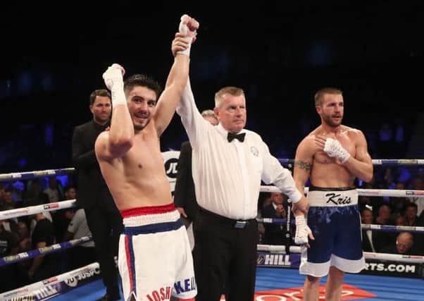 Josh Kelly celebrates his win against Kris George. Picture by Lawrence Lustig/Matchroom.