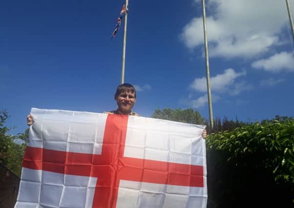 Lib Dem councillor Stephen O'Brien with an England flag.