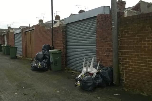Rubbish dumped at the rear of Courtney Small's home in Oswald Street