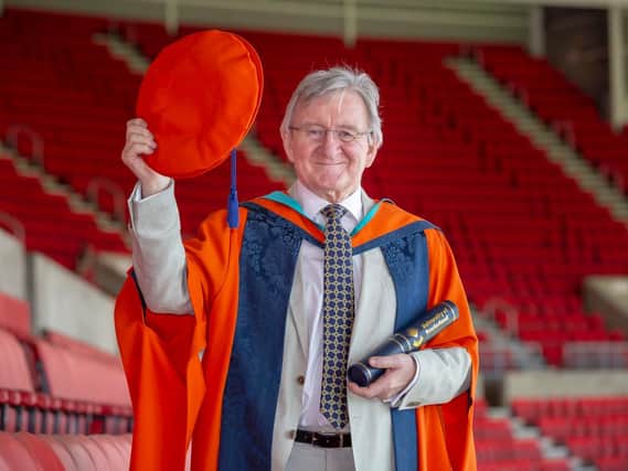 Dr Chris Steele picking up his honorary degree at the University of Sunderland