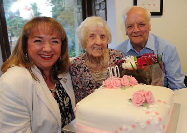 100 year old Wyn Davison celebrates her birthday, with nephew Ron Clark and Sharon Hodgson MP.