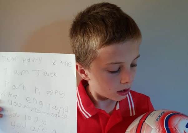 Jack Berry with his letter to Harry Kane.