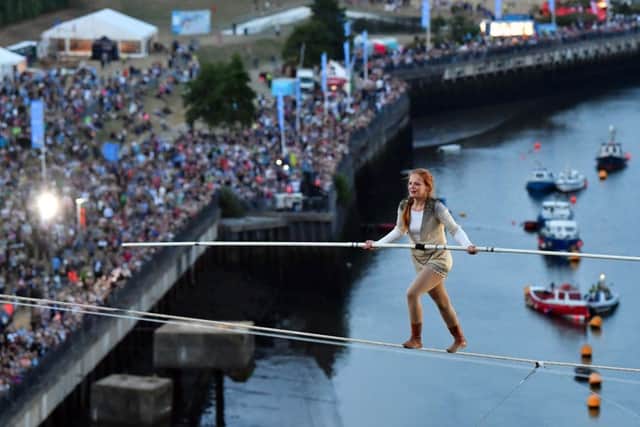 High wire walker Johanne Humblet making her way over the River Wear as huge crowds watch below.