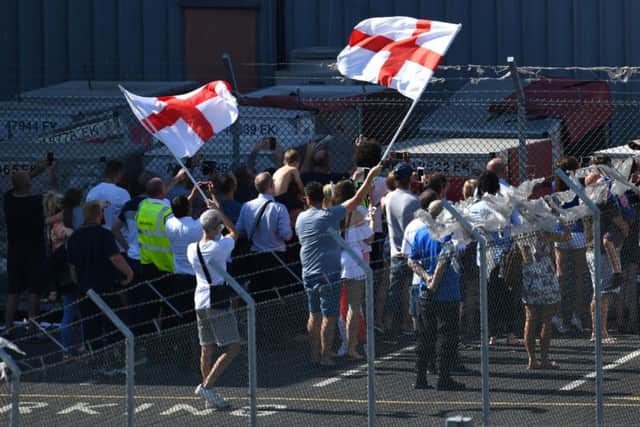 Fans await the arrival of the England team at Birmingham Airport. Pic: Joe Giddens/PA Wire.