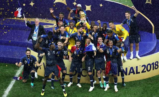 France celebrate with the trophy after winning the World Cup.