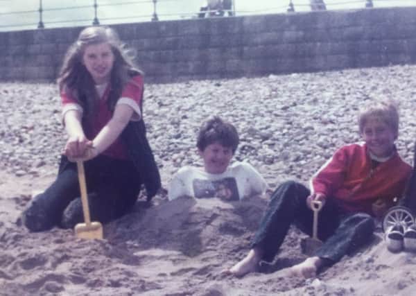Phil and Roger play on Seaburn beach with their cousin Gaynor.
