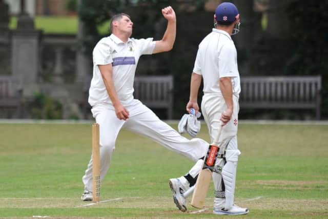 Whitburn bowler Craig Smith enters his delivery stride in Saturday's clash with Felling.