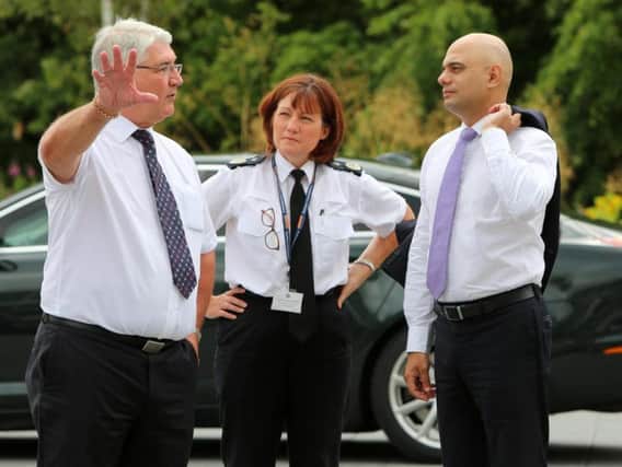 Home Secretary Sajid Javid is greeted by Deputy Chief Constable Jo Farrell and Police, Crime and Victims Commissioner Ron Hogg.