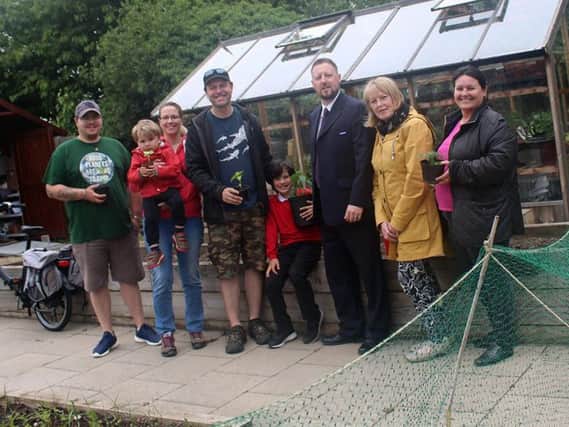 From left, SPACE volunteer Shaun Stevenson, Hollie Jobes with son James, two,garden trustee Graeme Jobes with son Luke, seven,Wayne Doran from Stagecoach North East's Sunderland depot and St Peter's ward Coun Julia Jackson.