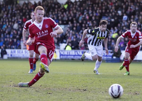 Adam Rooney converts a penalty for former club Aberdeen