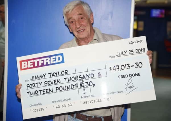 Jimmy Taylor with his winning cheque