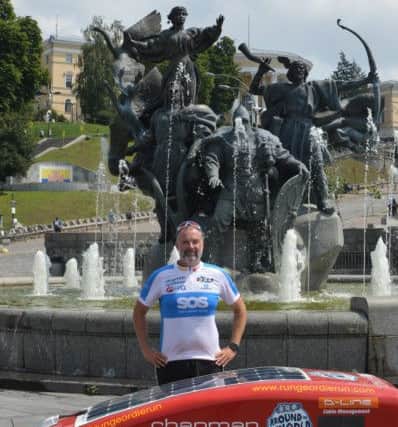 Mark Allison in Kiev at the end of the latest stage of his round the world run.