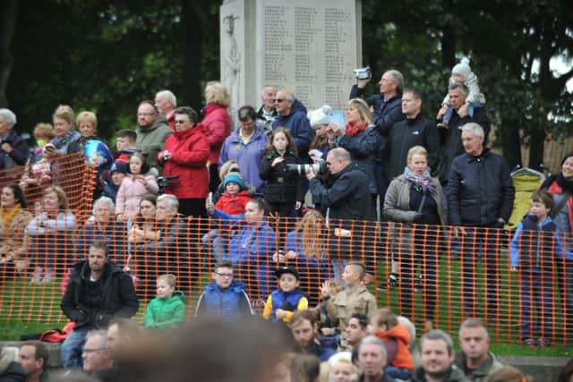Crowds watch as Houghton Feast's Annual Parade travels along Newbottle Street.
