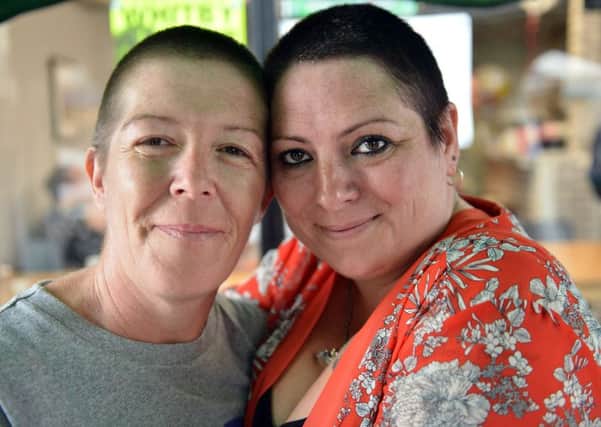 Linda Cook and her niece Deborah Adcock after getting their head shaved in memory of Linda's late father John White.