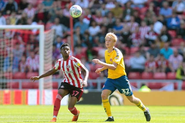 Charlton Athletic's George Lapslie (right) and Sunderland's Bali Mumba during the Sky Bet League One match at the Stadium of Light, Sunderland. PRESS ASSOCIATION Photo. Picture date: Saturday August 4, 2018. See PA story SOCCER Sunderland. Photo credit should read: Graham Stuart/PA Wire. RESTRICTIONS: EDITORIAL USE ONLY No use with unauthorised audio, video, data, fixture lists, club/league logos or "live" services. Online in-match use limited to 75 images, no video emulation. No use in betting, games or single club/league/player publications.