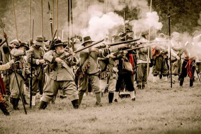 The sights and sounds of muskets in battle.