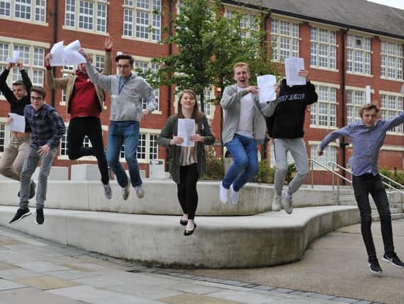 Sunderland College students jump for joy at A-level results.
