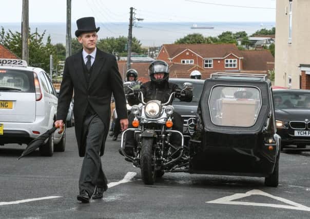 Funeral of motorbike lover Raymond Little, in one of the country's only Harley Davisdon hearse, at the Salvation Army Church.