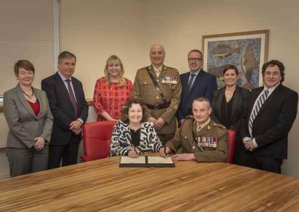 The University of Sunderland signing of the Armed Forces Covenant.
L-R: (standing)  Kirsten Black, Steve Knight, Sue Brent, Warrant Officer Den Mustard, Mark Willis, Alison Rutherford and Prof Tony Alabaster.
Seated: Shirley Atkinson and Major Thomas McVey.