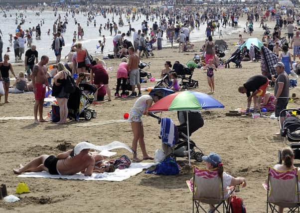 Flexible working would leave more time for families to do things like enjoying the beach.