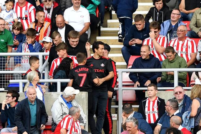 Sunderland director Juan Sartori, pictured in the new away strip, joined fans in the South Stand during the second half of the Scunthorpe United game.