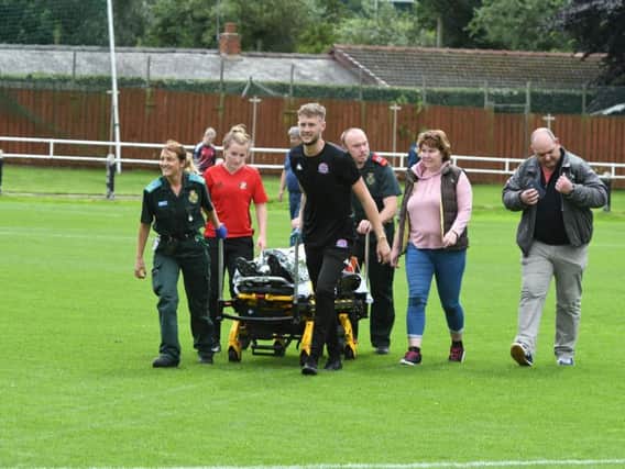 The North East Ambulance Service was called to the match to treat player Courtney Stewart who had collapsed.