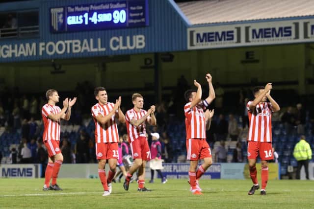 Sunderland players applaud supporters after the team's 4-1 win at Gillingham.