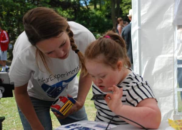 Photographer Jo Howell with youngster Paige Harvey at a #wearexperimenting workshop